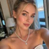 Silver moissanite pear necklace on display bust with pendant and clasp close-ups - gala dinner